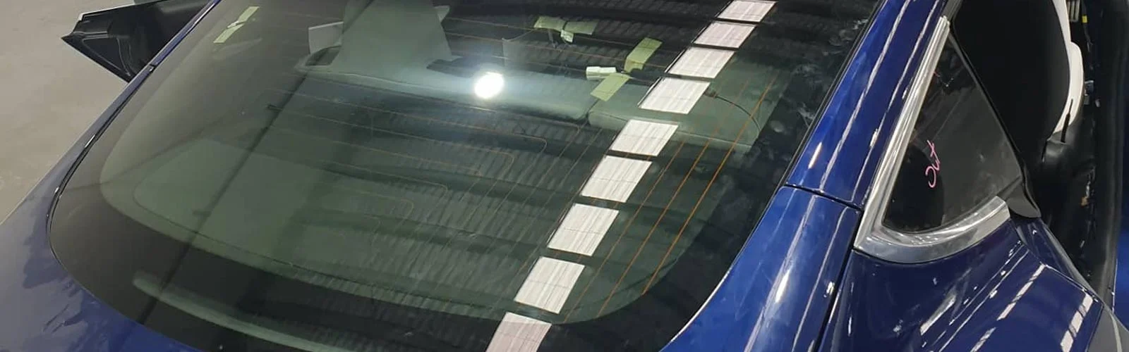 car window replacement service close-up technician working