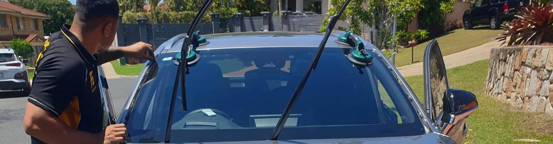 car window replacement service close-up technician working